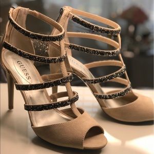 The glitzy side of Guess. Cage Sandals, tan suede. My Guess is as good as yours